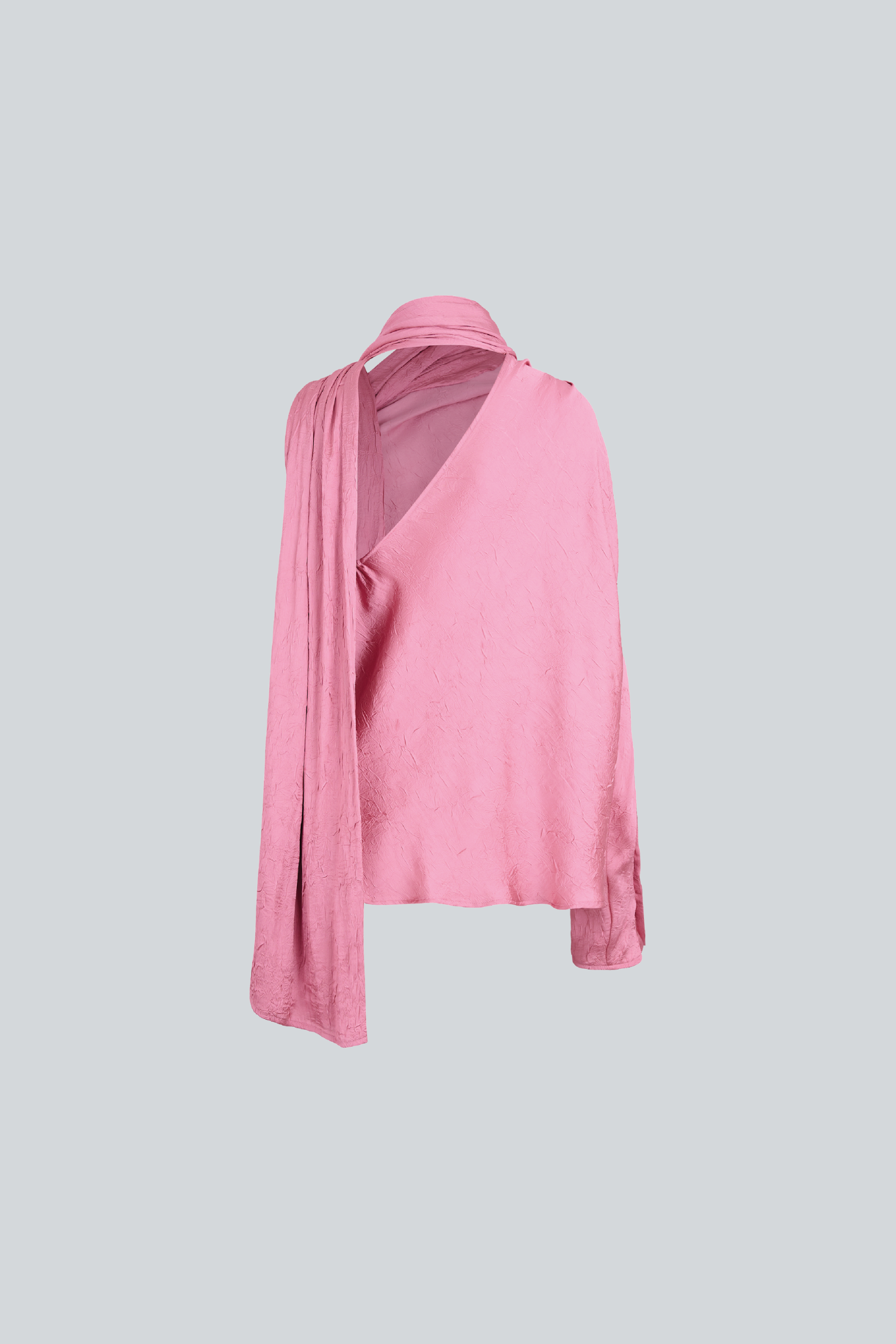Blusa asimétrica de manga larga con lazo al cuello para mujer de diseñador latinoamericano vista posterior.