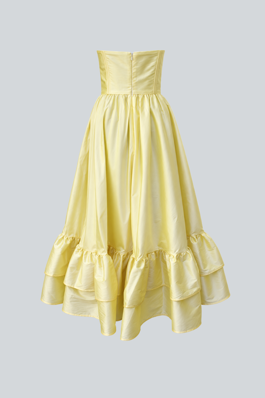 Vestido Luciana de Jeanette Toscano visto por detrás en color butter yellow con silueta midi